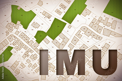 IMU (which means Unique Municipal Tax) the most unpopular italian tax on land and buildings - concept with cadastral map photo