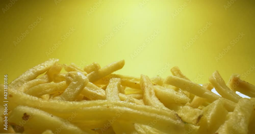 detailed extreme close-up of hot fries with smoke on yellow background. detailed extreme close-up of hot fries with smoke on yellow background.