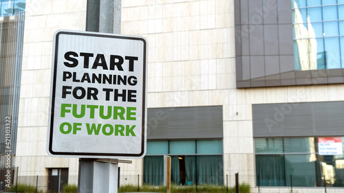 Start Planning for the future of work sign in a downtown city setting