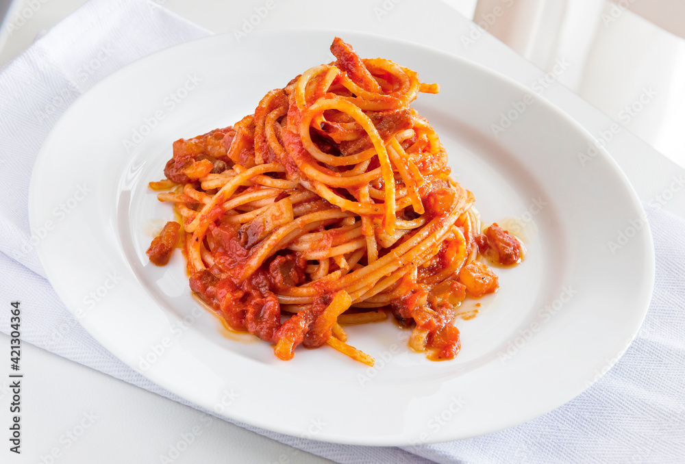 Plate of spaghetti with tomato and bacon Plate of spaghetti with tomato and bacon