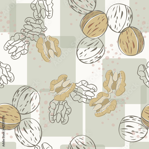Vector Nuts Walnuts in Brown Tan on Green Squares Background Seamless Repeat Pattern. Background for textiles, cards, manufacturing, wallpapers, print, gift wrap and scrapbooking.