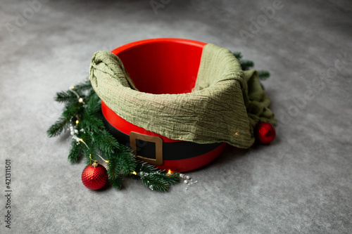 baby seat for newborn photo shoot. Christmas balls and highlights