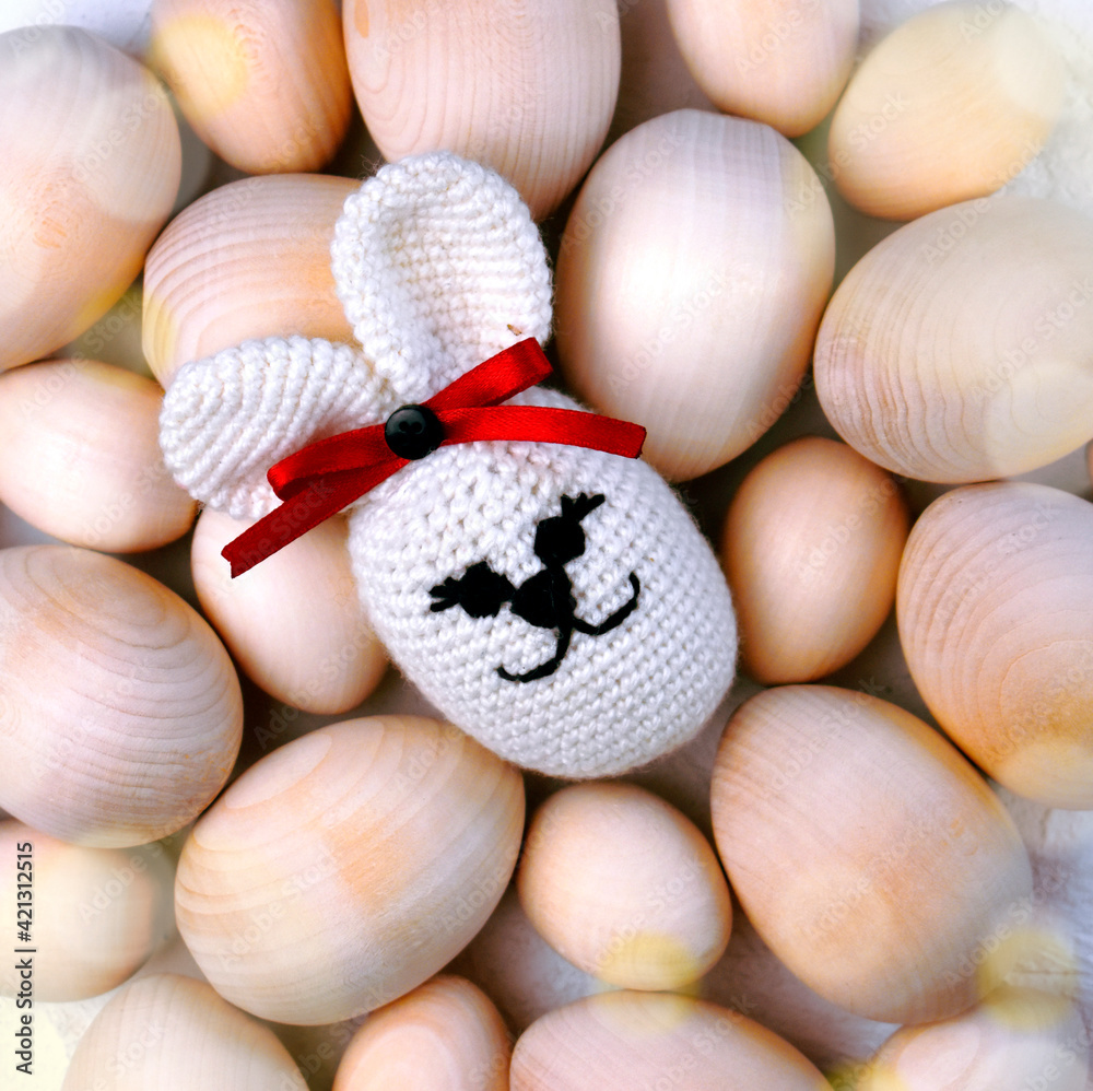 Easter holiday background with wooden eggs and bunny toy. Handmade creative concept. Eco friendly style. Easter holiday background with wooden eggs and bunny toy. Handmade creative concept. Eco friendly style.