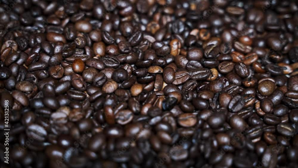 Slow background movement of coffee beans Slow background movement of coffee beans