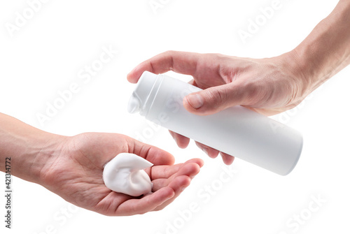 Shaving foam bottle in hands close-up on a white background. Mockup, layout photo