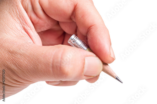 Hand with very short pencil isolated on white background, make a long story short, writing briefly concept photo