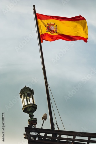 Linterna de popa y bandera del reino de España. Celebración día de la hispanidad photo