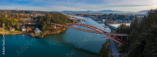 Rainbow Bridge and the City of La Conner, Washington. La Conner is a popular tourist town known for its arts and craft shops located in the beautiful Skagit Valley. Rainbow Bridge is an icon landmark.