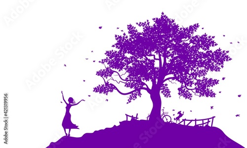 Joyful girl and her dog near the big old tree.
