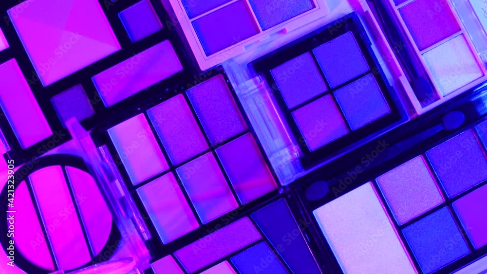 Make up eye shadow palettes with sci fi cyber punk light effects. Flat lay Make up eye shadow palettes with sci fi cyber punk light effects. Flat lay