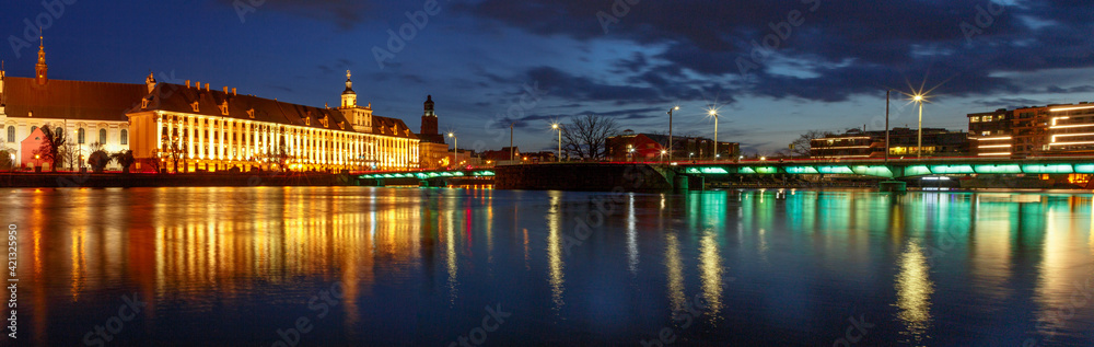 night view of the river and the old districts of the city of wroclaw in poland