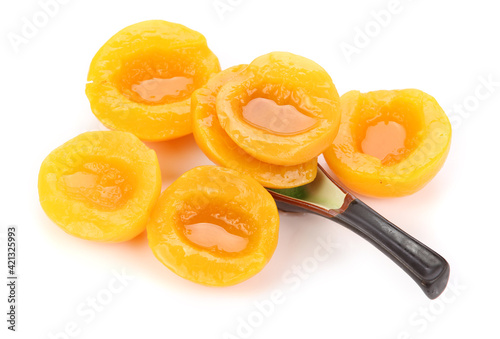 Canned peach on syrup over white background