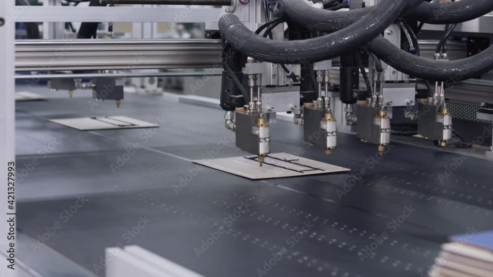 Modern automatic machine line of cardboard box. Offset printing machine - spraying glue. Conveyor line for the production Manufacture of cardboard boxes from paper. gluing of cardboard.