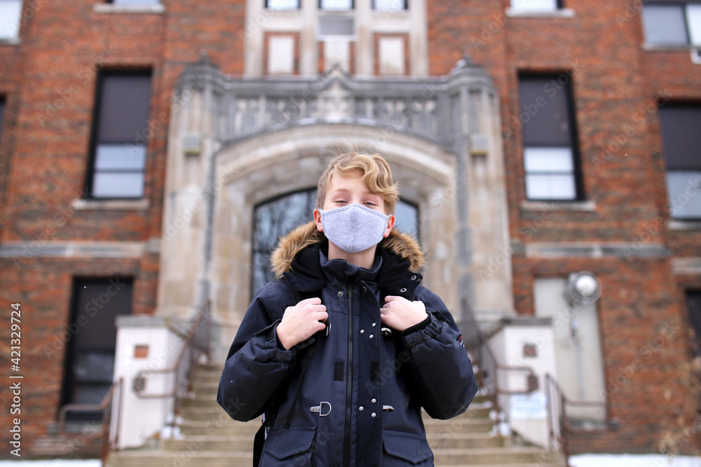 Fifth Grade Boy Child in Covid Face Mask Outside Middle School Education Building