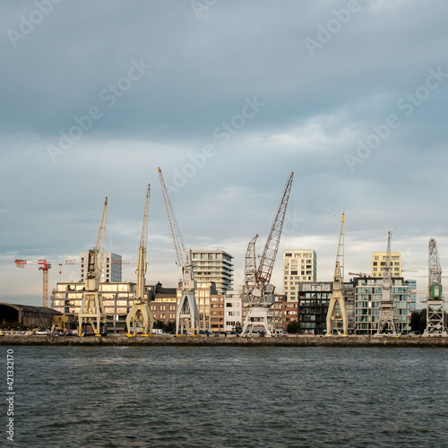 Old harbor cranes in the city of Antwerp.