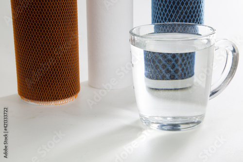 Replaceable filters for cleaning tap water. Three-stage water treatment system.