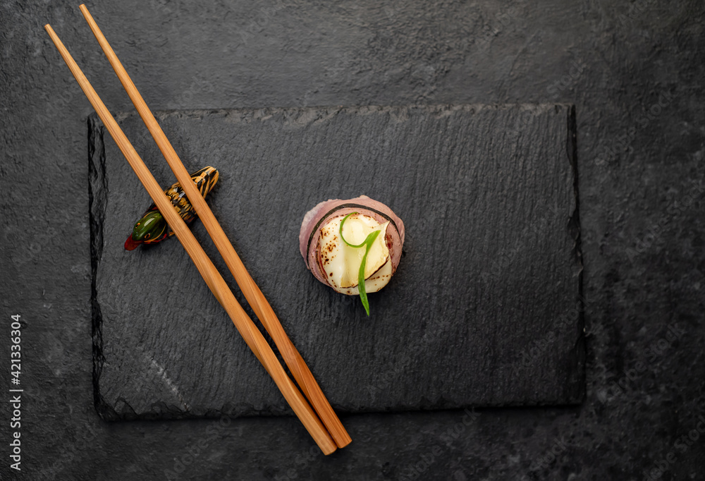 gunkan with hot tuna on a stone background gunkan with hot tuna on a stone background