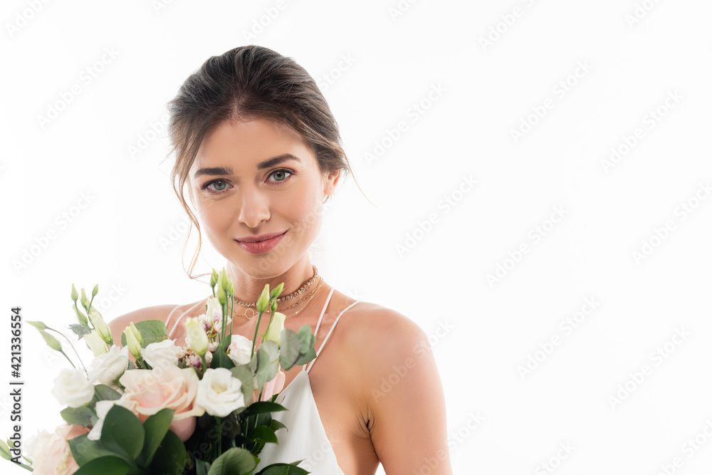 happy fiancee smiling at camera while holding wedding bouquet isolated on white happy fiancee smiling at camera while holding wedding bouquet isolated on white