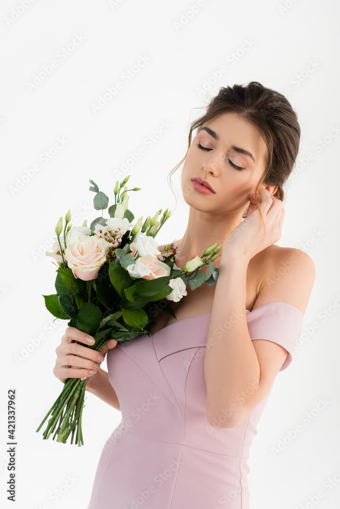 sensual woman holding hand near face while posing with wedding bouquet isolated on white sensual woman holding hand near face while posing with wedding bouquet isolated on white