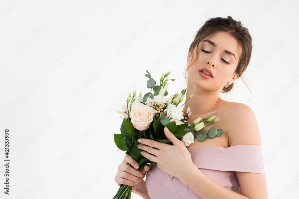 sensual fiancee holding wedding bouquet while posing with closed eyes isolated on white sensual fiancee holding wedding bouquet while posing with closed eyes isolated on white