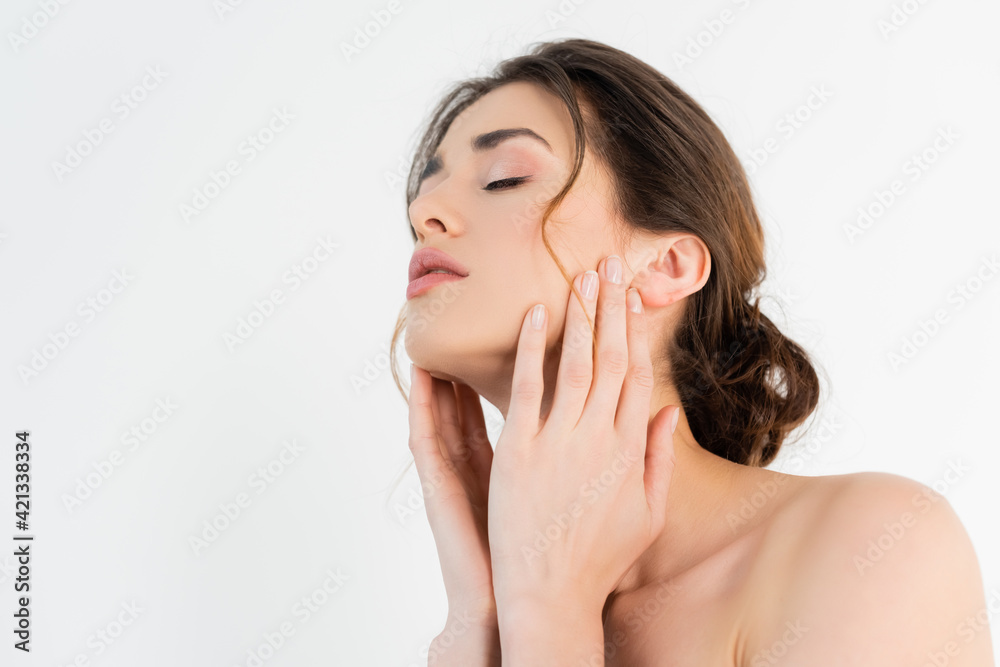 sensual woman with naked shoulders holding hands near face isolated on white sensual woman with naked shoulders holding hands near face isolated on white