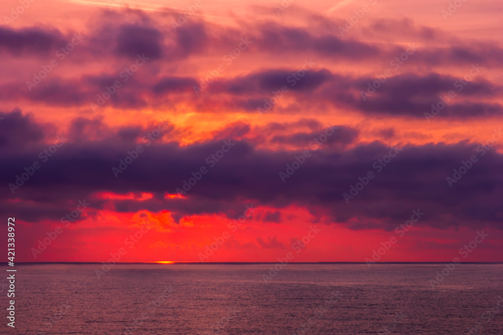 Fototapeta premium Amazing red sunrise or sunset over the sea. Nature background