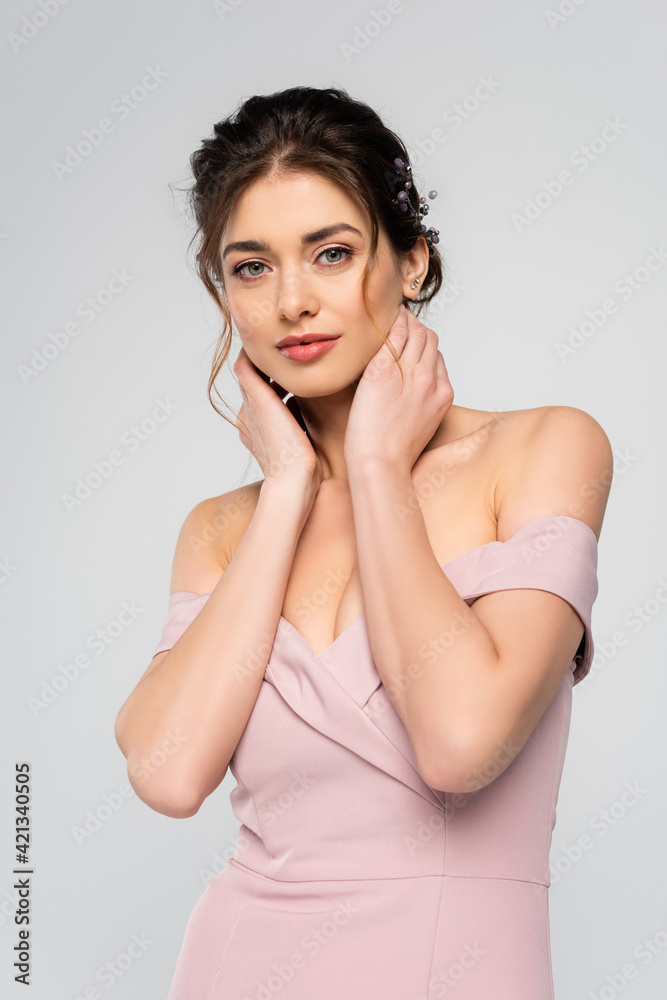 young fiancee touching neck while looking at camera isolated on grey young fiancee touching neck while looking at camera isolated on grey