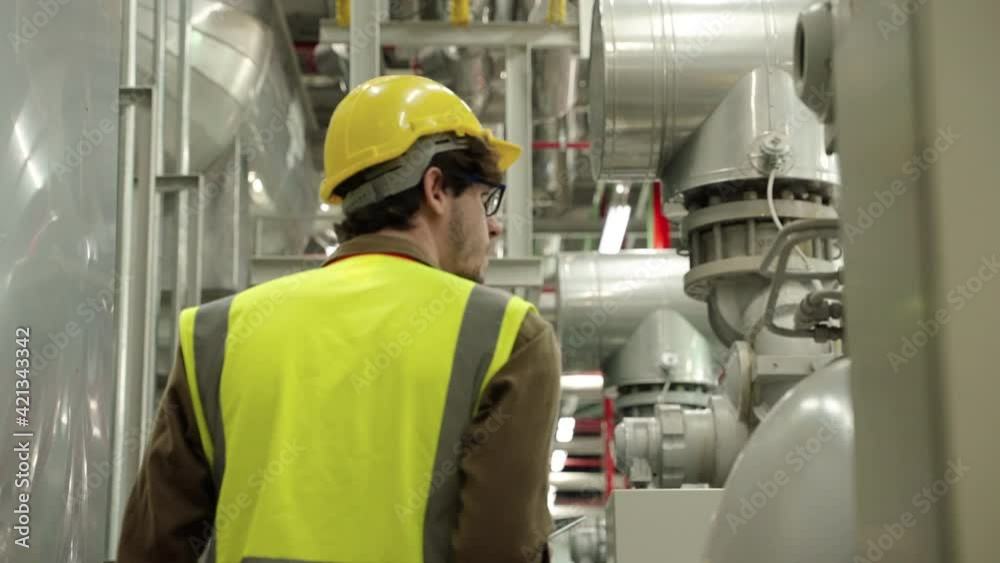 nspector, Engineer Or the foreman is checking the valve and pipelines in the boiler room in the factory.
nspector, Engineer Or the foreman is checking the valve and pipelines in the boiler room in the factory.