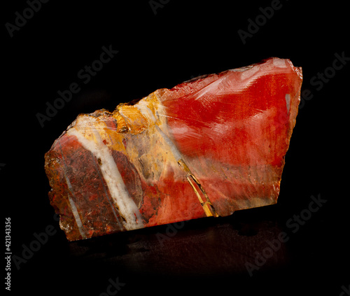 Red beautiful jasper mineral crystal from Orsk, Ural, Russia. A photo of a stone isolated on black. For geology or mineralogy websites, stone collection catalog, Natural Science museum wall charts.