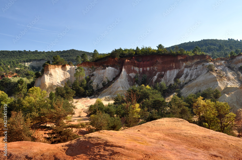 Red and white rocks in the south of France at the site of a former quarry - Colorado de Rustrel, France