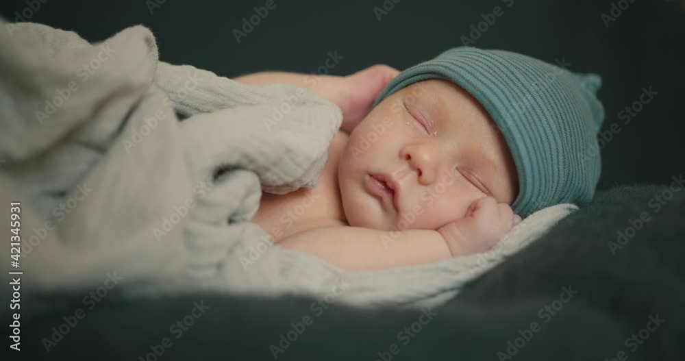 Sleeping newborn baby in plaid Sleeping newborn baby in plaid