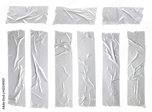 Set of crumpled silver grey adhesive tape on white background. Torn and wrinkled pieces of gray sticky duct tape.