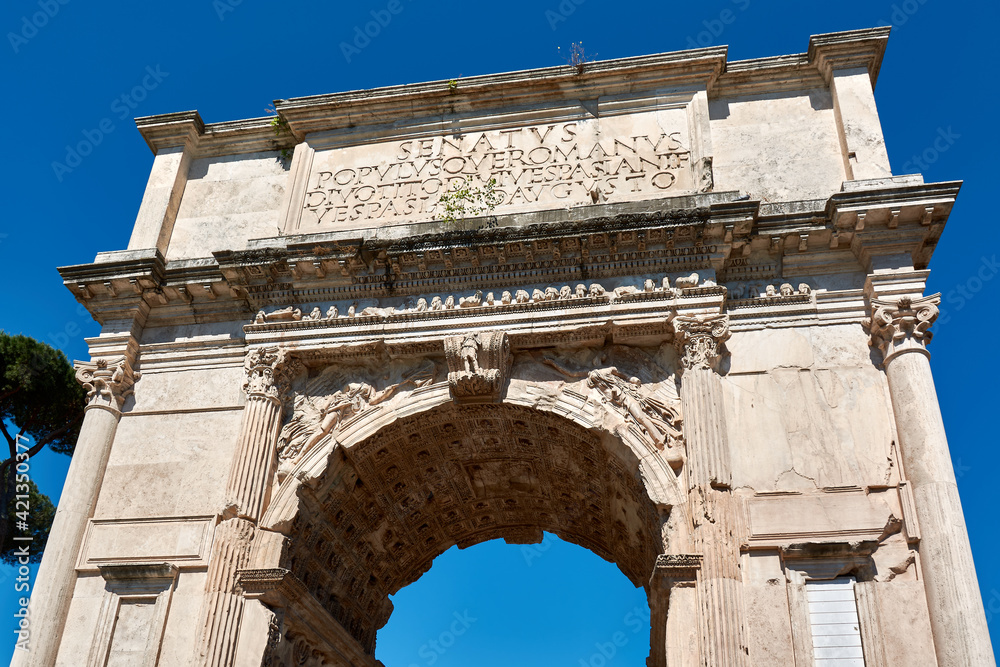 Details of the front of the Arch of Titus at the entrance of the Roman Forum, in Rome.