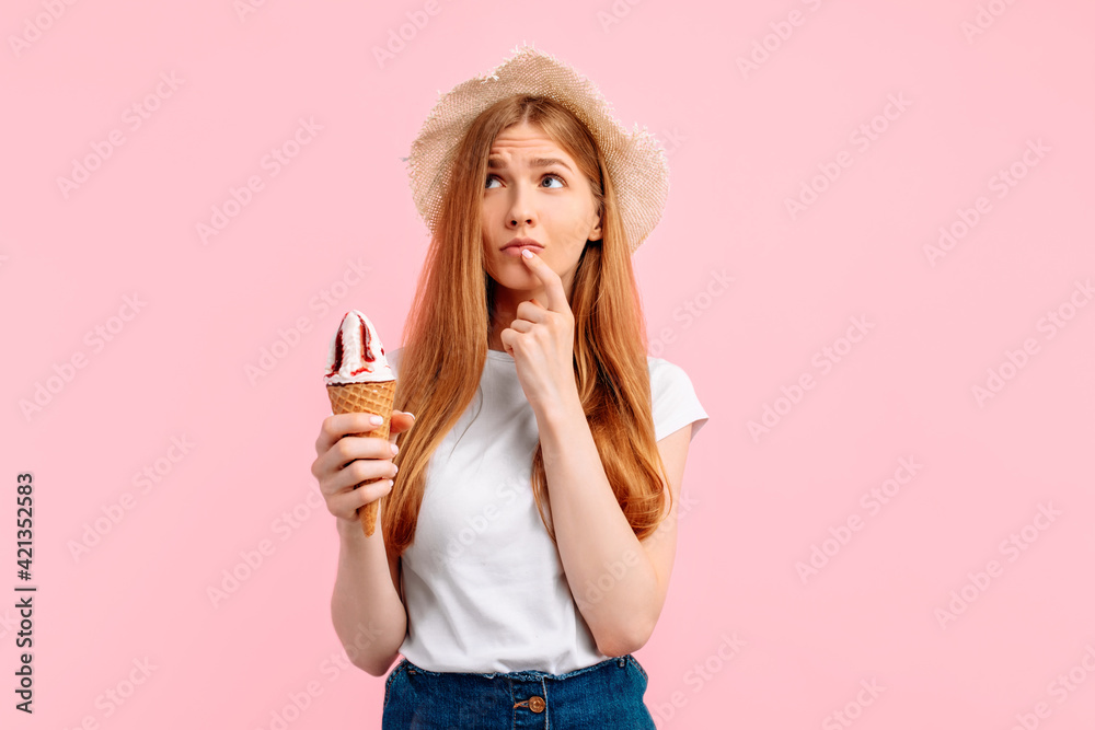 Thinking, young woman, with delicious ice cream on a pink background