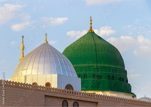 The famous green and silver domes of the Prophet's Mosque. The mosque was founded by Prophet Muhammad. Masjid an-Nabawi. photo