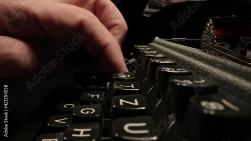 Writing a letter on an old typewriter - very nostalgic - probe lens close up shot photo