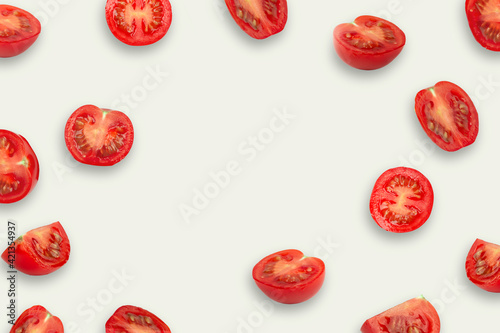 Creative layout of tomatoes on a pink background. Food concept. Сopy spaсe