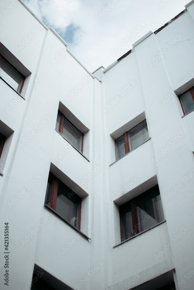 corner of the white facade of a Soviet constructivist building