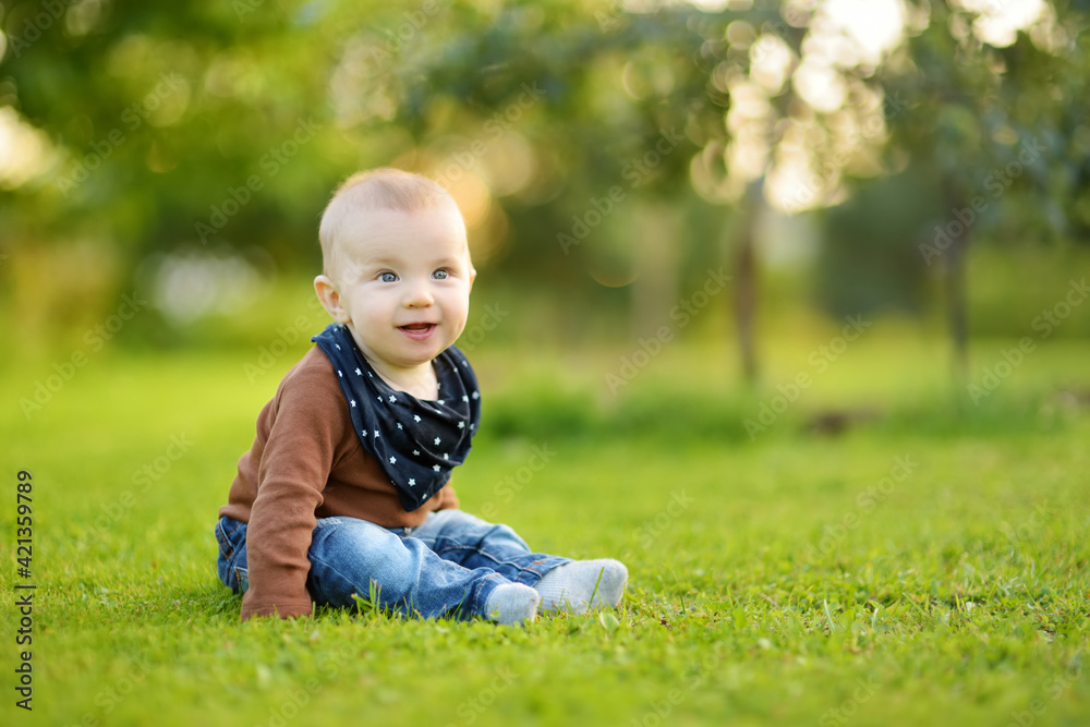 Cute baby boy learning how to sit up without support. Baby during floortime. Adorable little child trying to sit up on his own. Cute baby boy learning how to sit up without support. Baby during floortime. Adorable little child trying to sit up on his own.