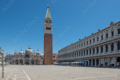 st mark's basilica of venice with tourists on a clear and sunny day