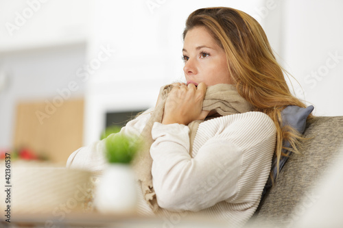 upset woman sitting on the couch