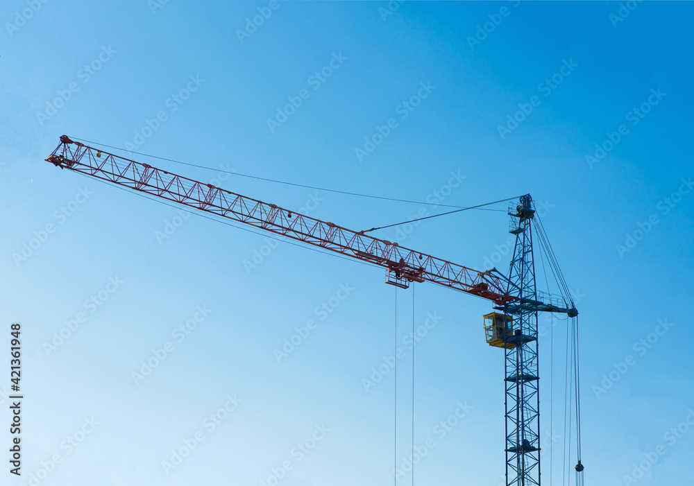 Industrial landscape, cranes, pipes with smoke. Air pollution from smokestacks, ecological problems.