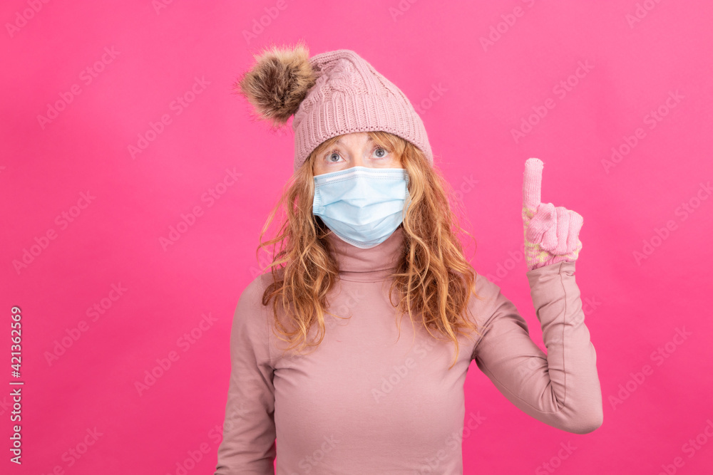 adult woman with mask isolated with winter clothes