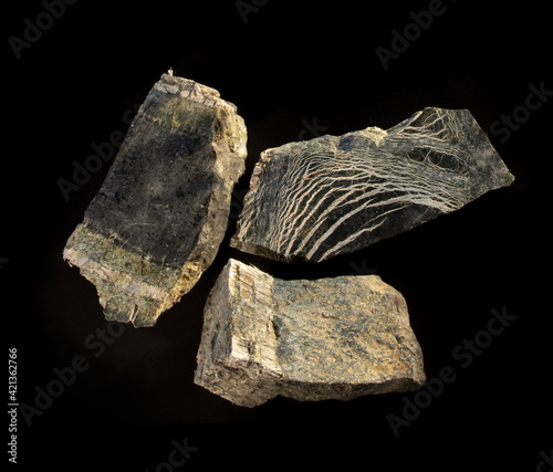 Serpentinite asbestos ore mineral from Asbest city, Ural, Russia. A photo of a stone isolated on black. For geology websites, stone collection catalog, Natural Science museum wall charts or posters.