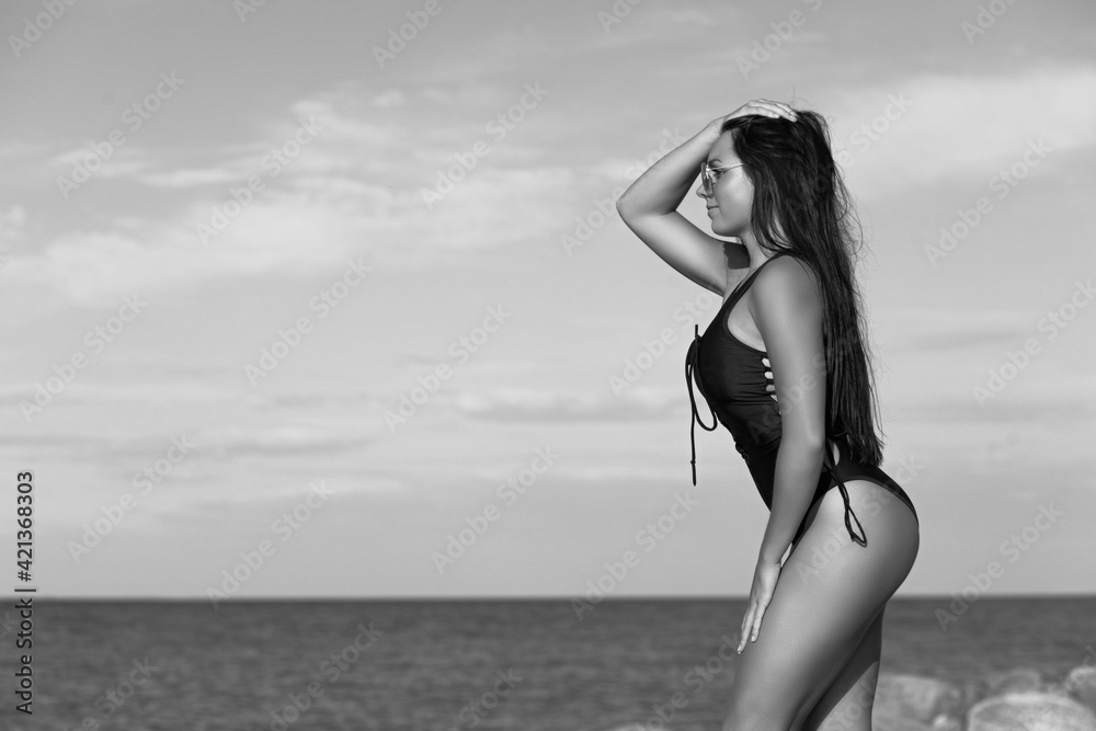 tanned girl with bikini on sea background