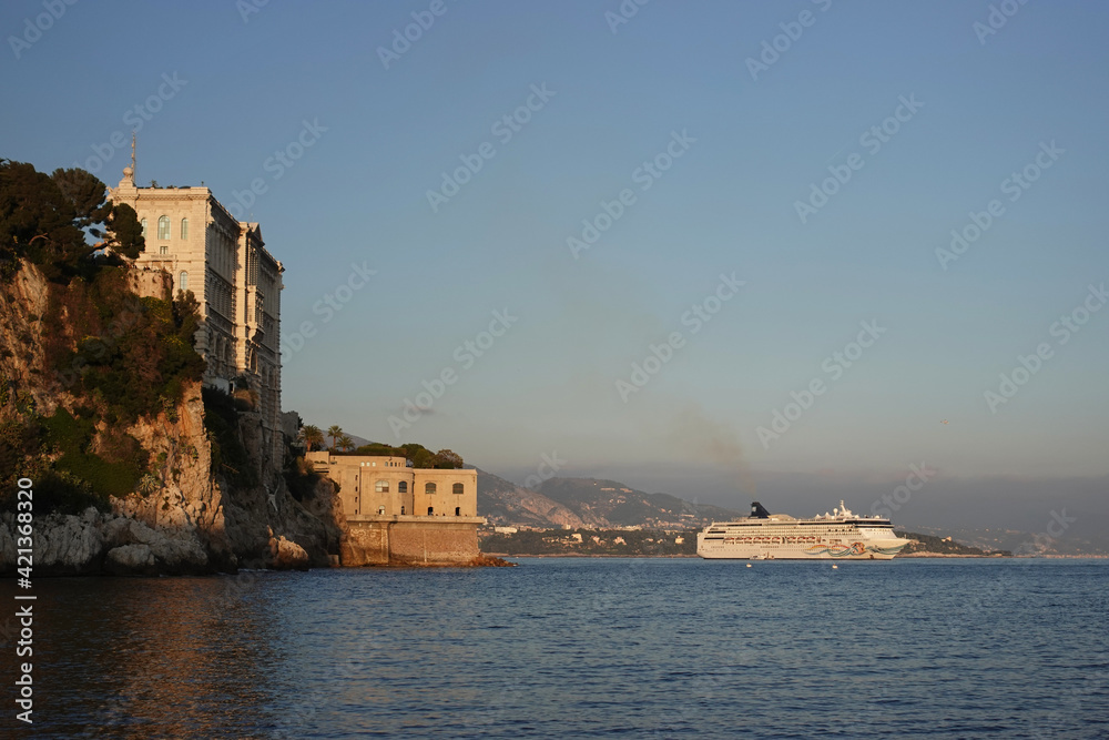 Palace in front of the sea and a boat