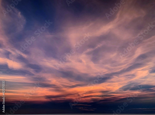 Fantastic sunset clouds in night sky. Purple magical cloudscape. Incredible heaven spectacle. © OLENA