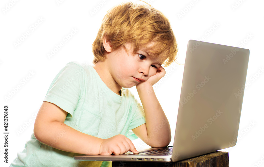 Learning. Child boy work with laptop. Homework. Lessons. School subjects. Education concept. E-learning. Online test.