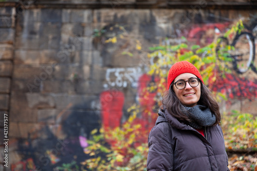 woman in red hat smiling, woman in an autumn forest