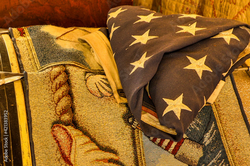USA, Washington State, Pomeroy. A folded American flag on top of a blanket. photo